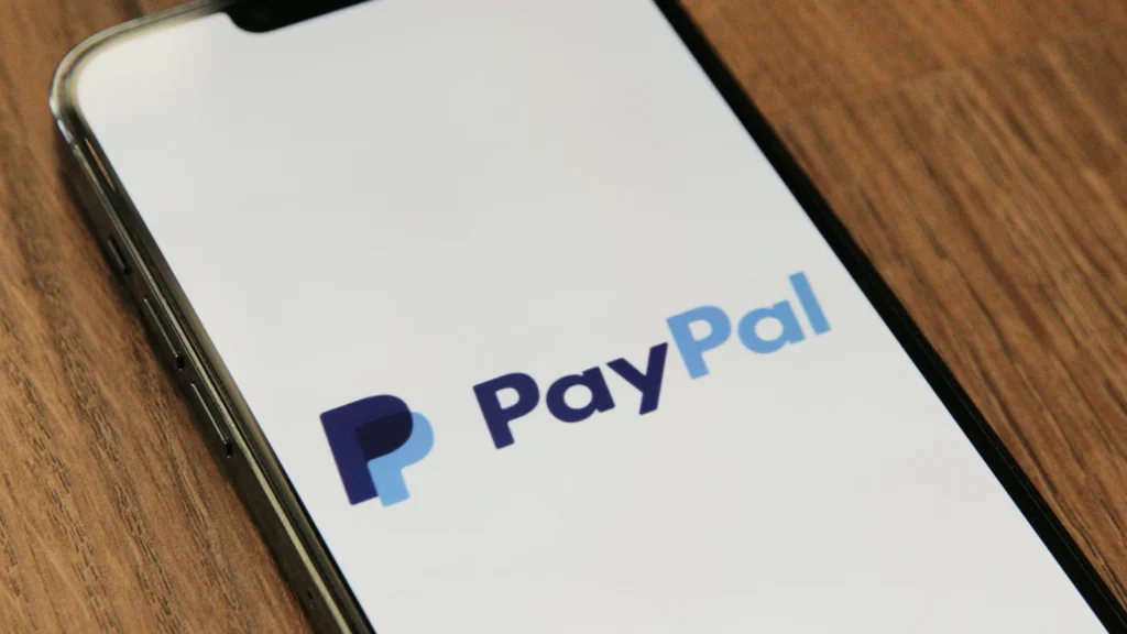 Digital infographic showing Stripe and PayPal logos with a rising green arrow indicating the PYPL stock price surge.